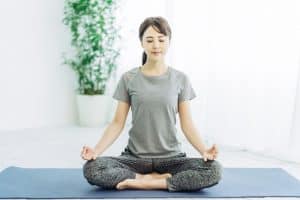 Woman Meditating at Home