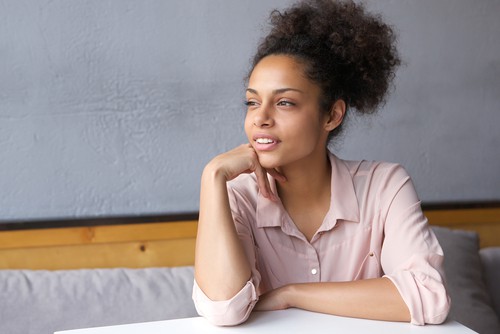 woman sitting thinking